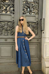 a lady in a denim lapel dress with a belt